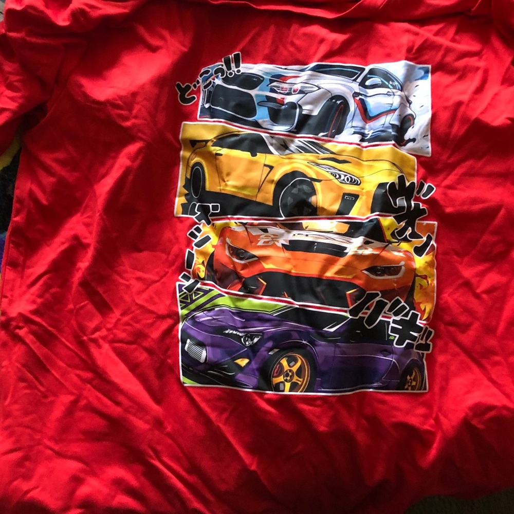 Anne Carson Red Tee with Dynamic Car Design